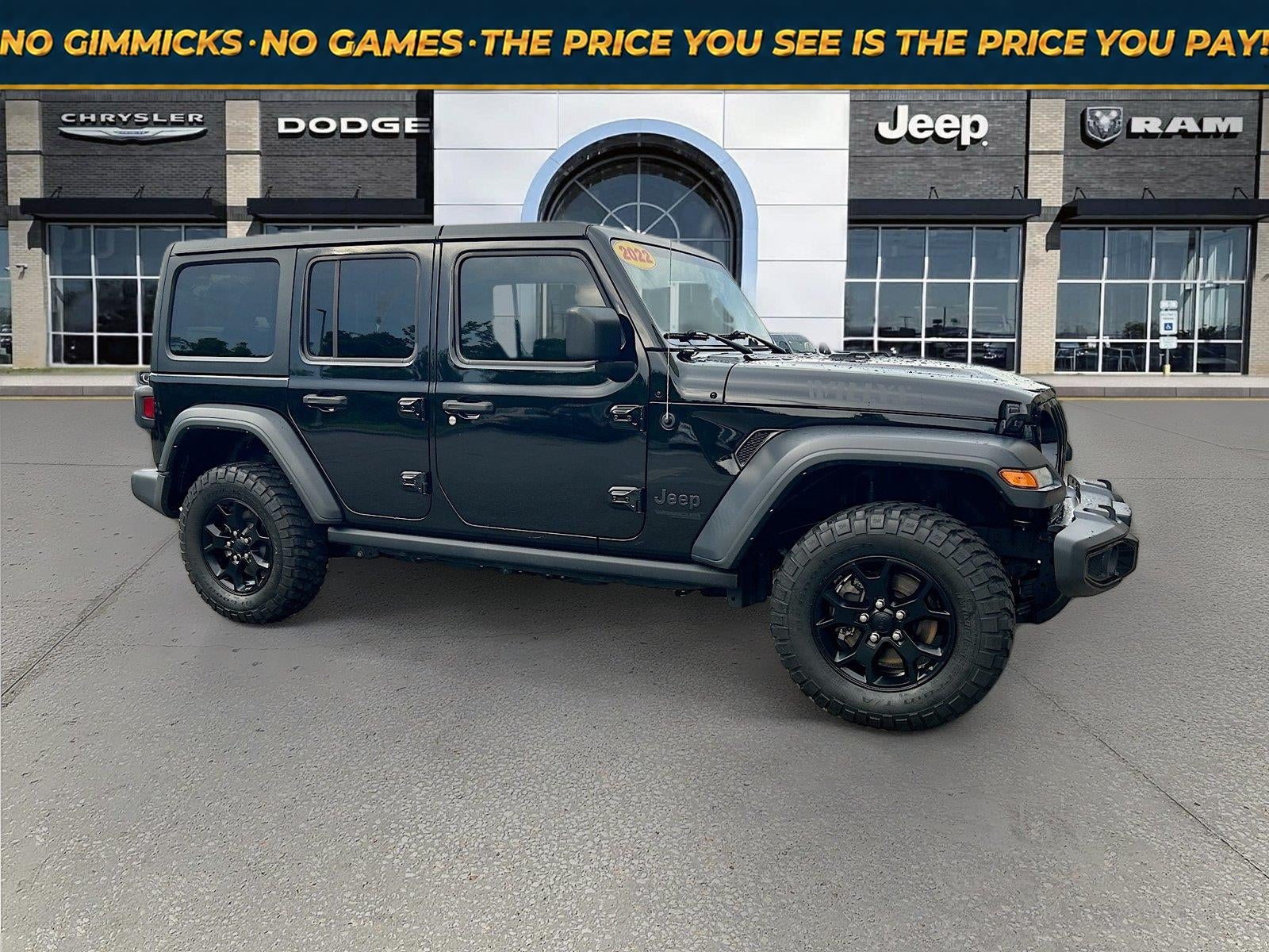 2022 Jeep Wrangler Unlimited Willys Sport 4x4 in Black Clearcoat — front three-quarter view