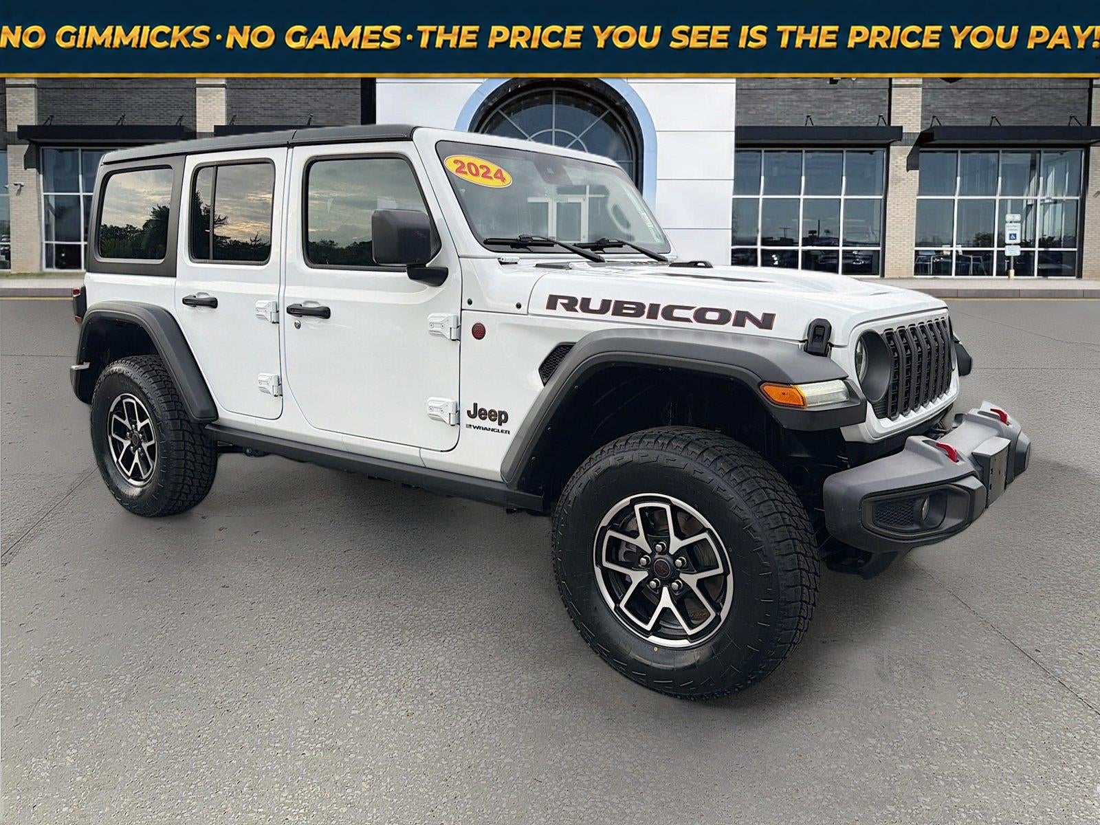 2024 Jeep Wrangler 4-Door Rubicon 4x4 in Bright White Clearcoat — front three-quarter view