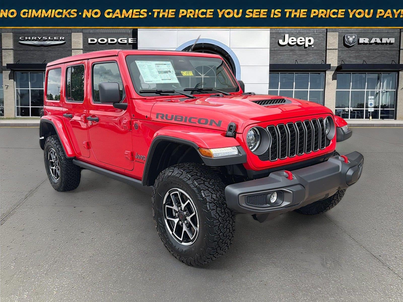 2026 Jeep Wrangler WRANGLER 4-DOOR RUBICON in Firecracker Red Clear-Coat Exterior Paint — front three-quarter view