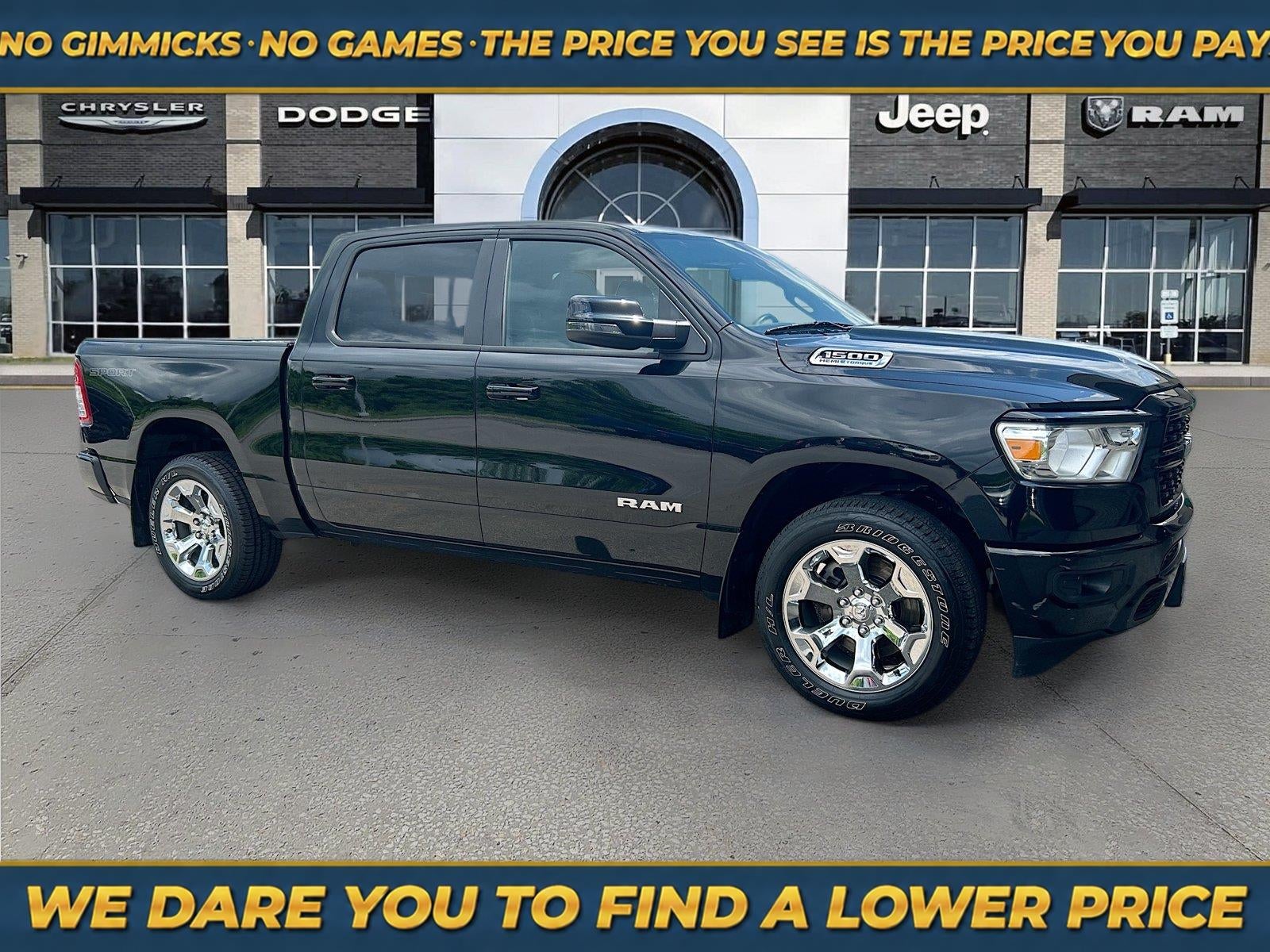 2023 RAM 1500 Big Horn Crew Cab 4x4 5'7' Box in Diamond Black Crystal Pearlcoat — front three-quarter view