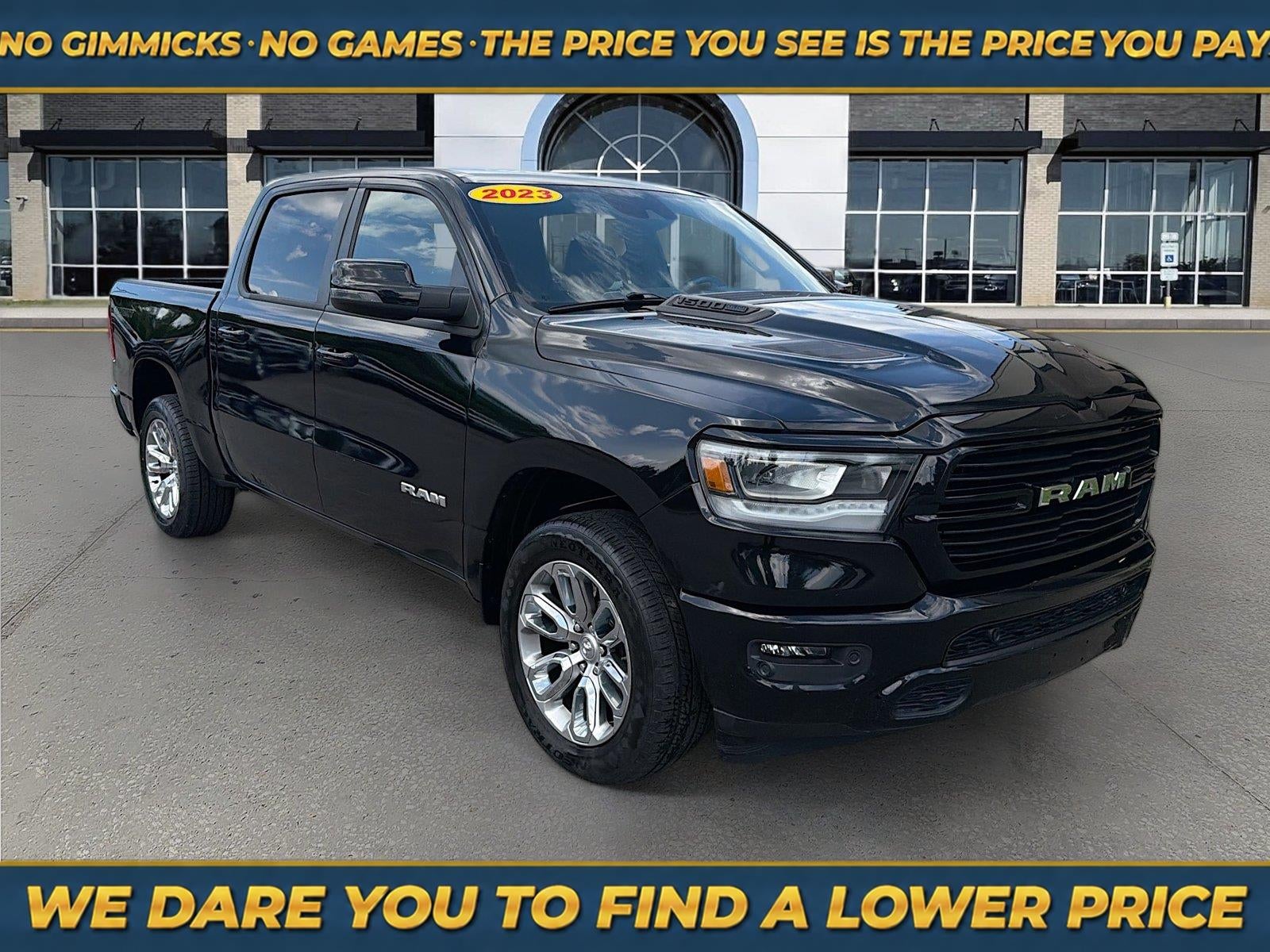 2023 RAM 1500 Laramie Crew Cab 4x4 5'7' Box in Diamond Black Crystal Pearlcoat — front three-quarter view