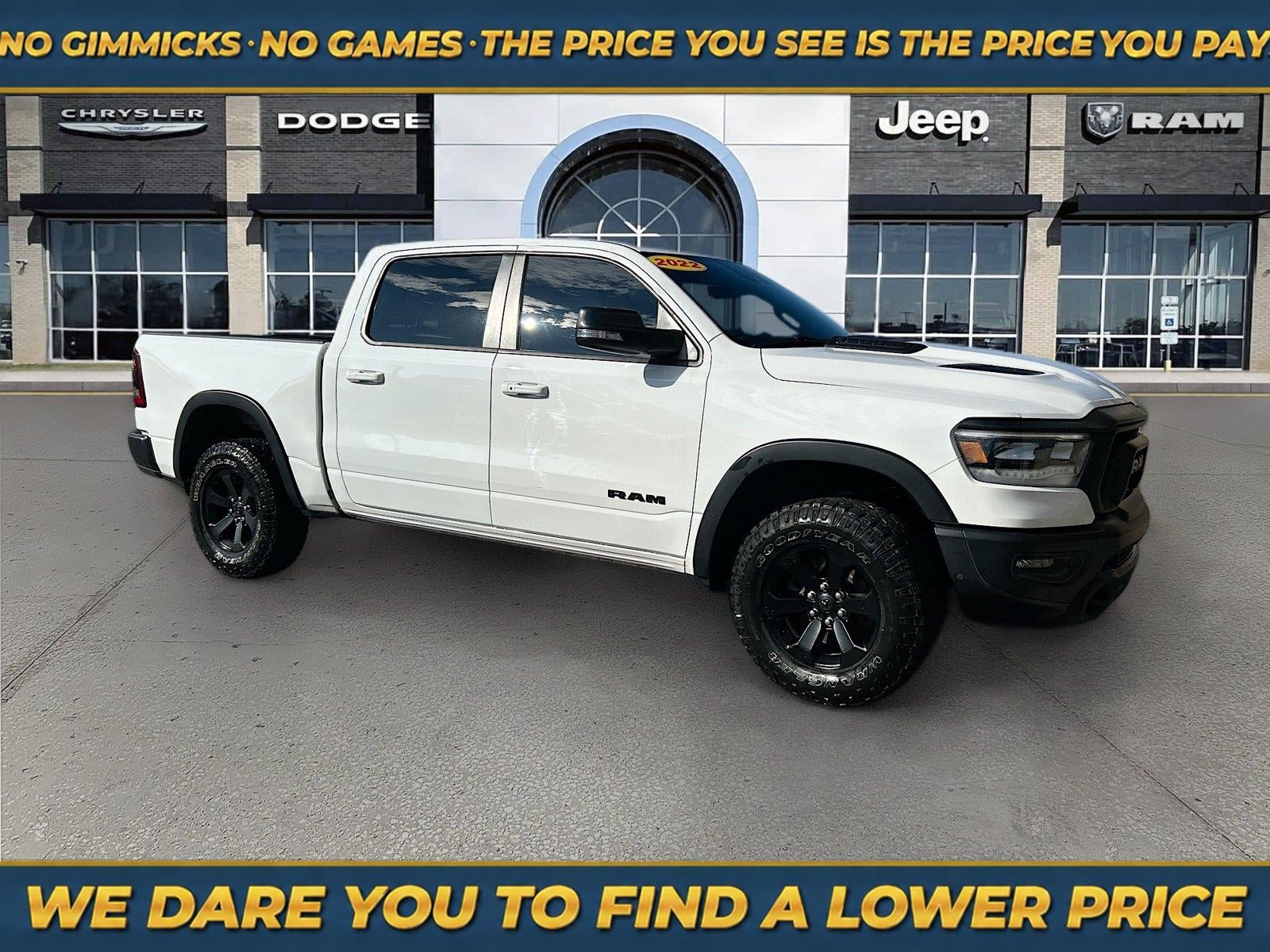 2022 RAM 1500 Rebel Crew Cab 4x4 5'7' Box in Bright White Clearcoat — front three-quarter view