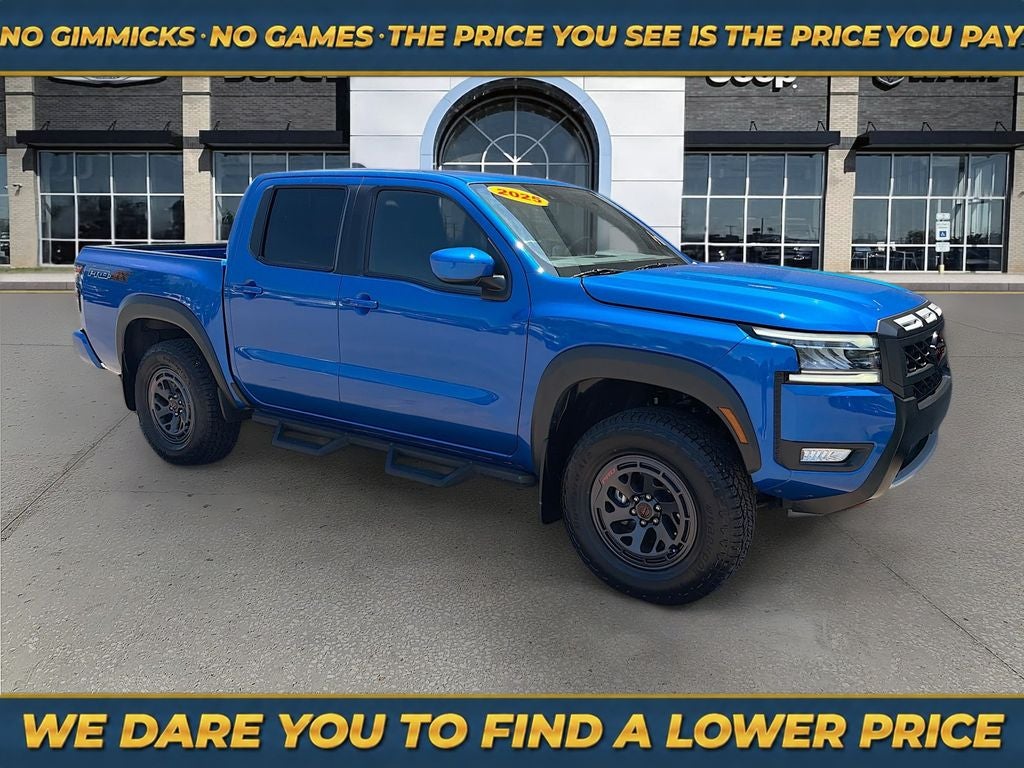2025 Nissan Frontier Crew Cab PRO-4X 4x4 in Bluestone Pearl — front three-quarter view