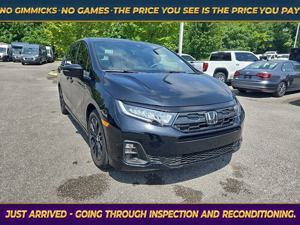 2026 Honda Odyssey Sport-L in Crystal Black Pearl — front three-quarter view