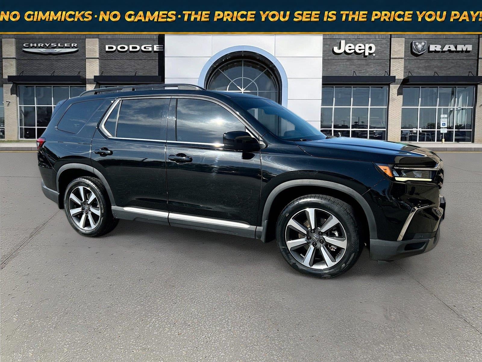 2023 Honda Pilot AWD Elite in Crystal Black Pearl — front three-quarter view